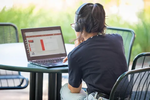 student working on their computer for independent studies