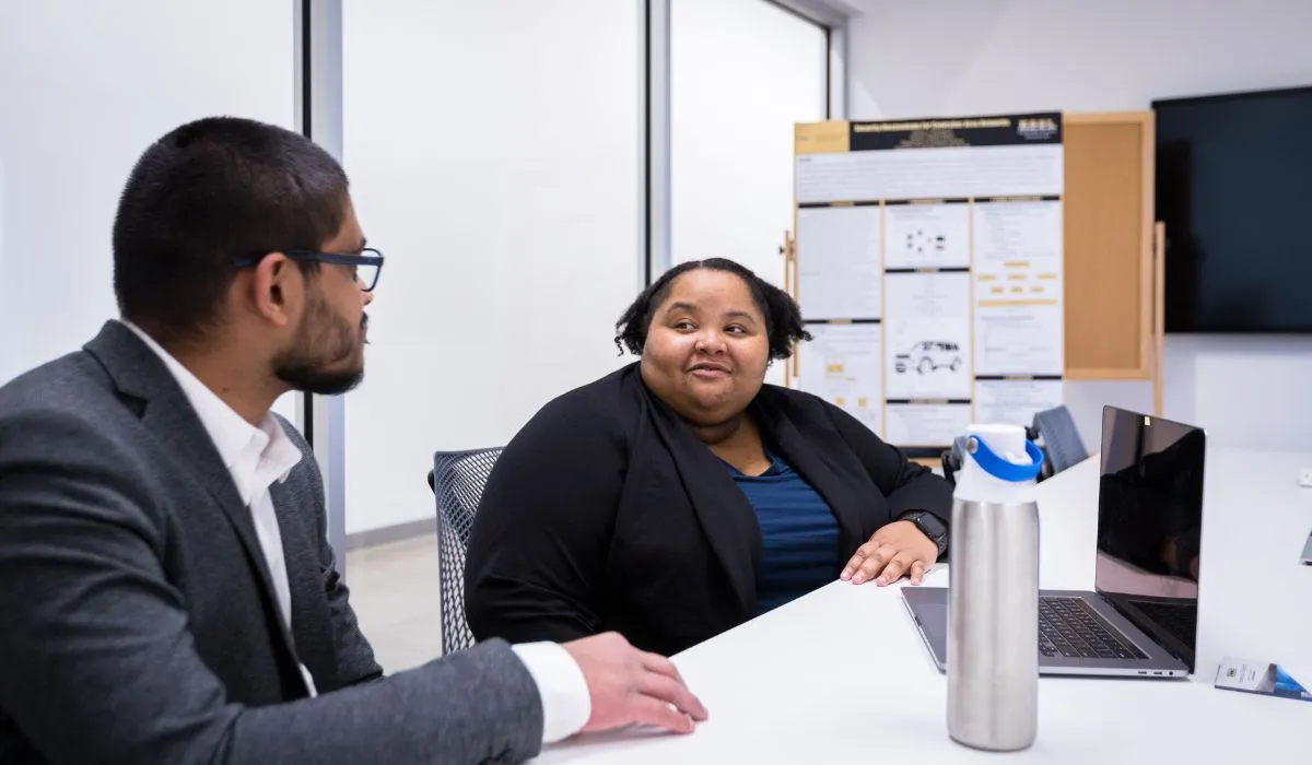 cybersecurity students in a meeting